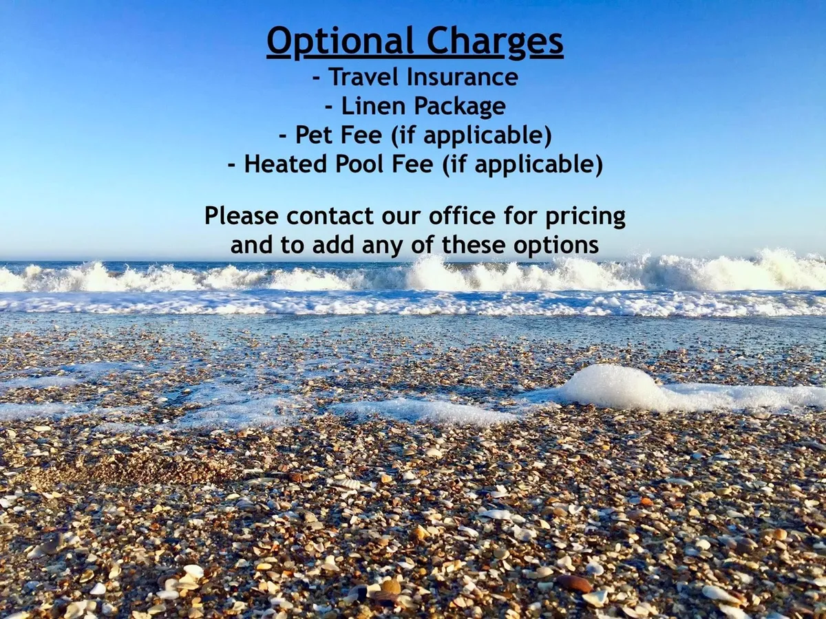 A sun-drenched stretch of North Topsail Beach, with gentle ocean waves lapping the sandy shore. The image features clear skies and footprints in the sand, and the scene invites families to build sandcastles, hunt for seashells, and enjoy time by the water.